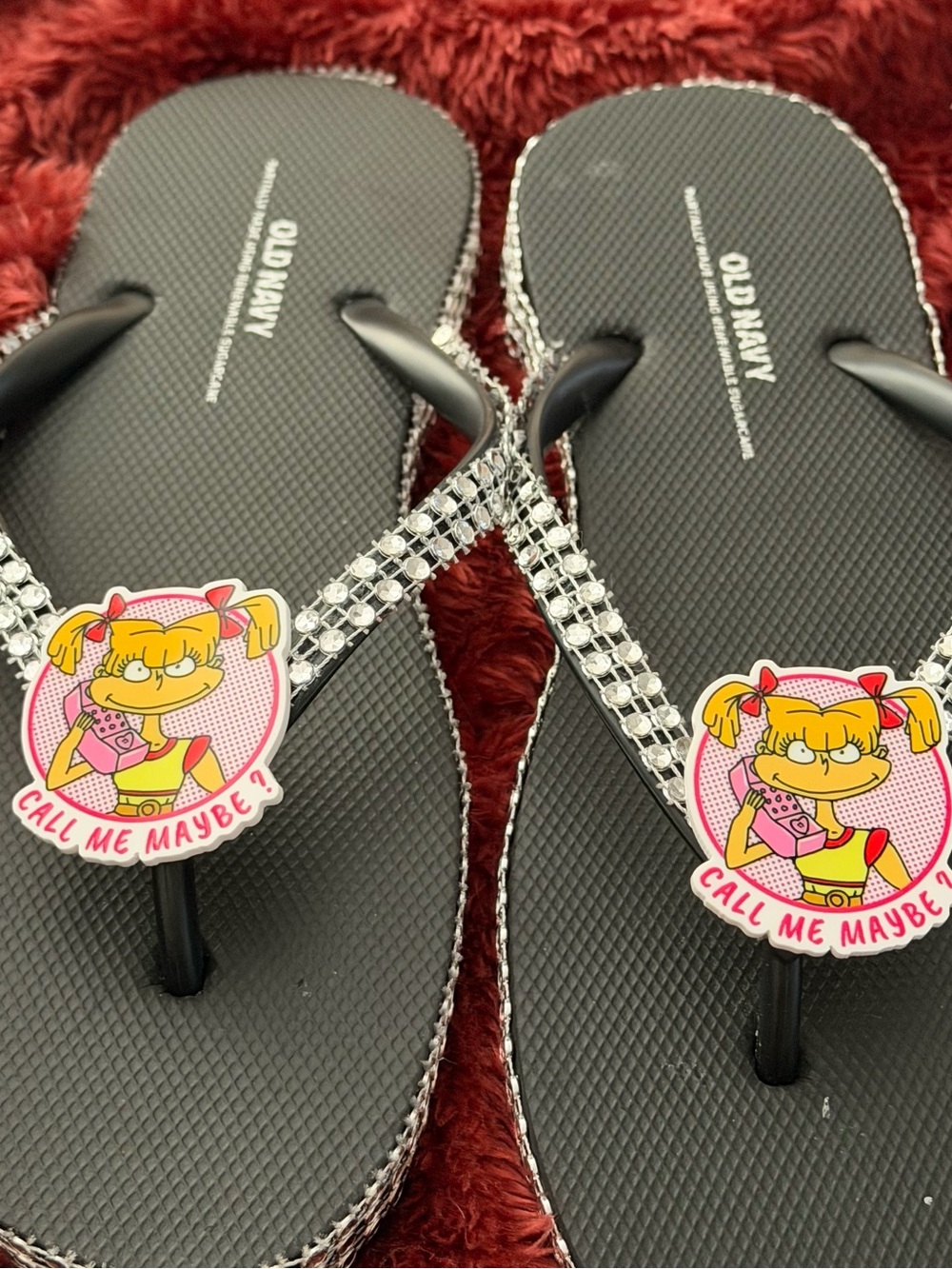 ' Black Rhinestone Flip Flops with Pink Character Charm